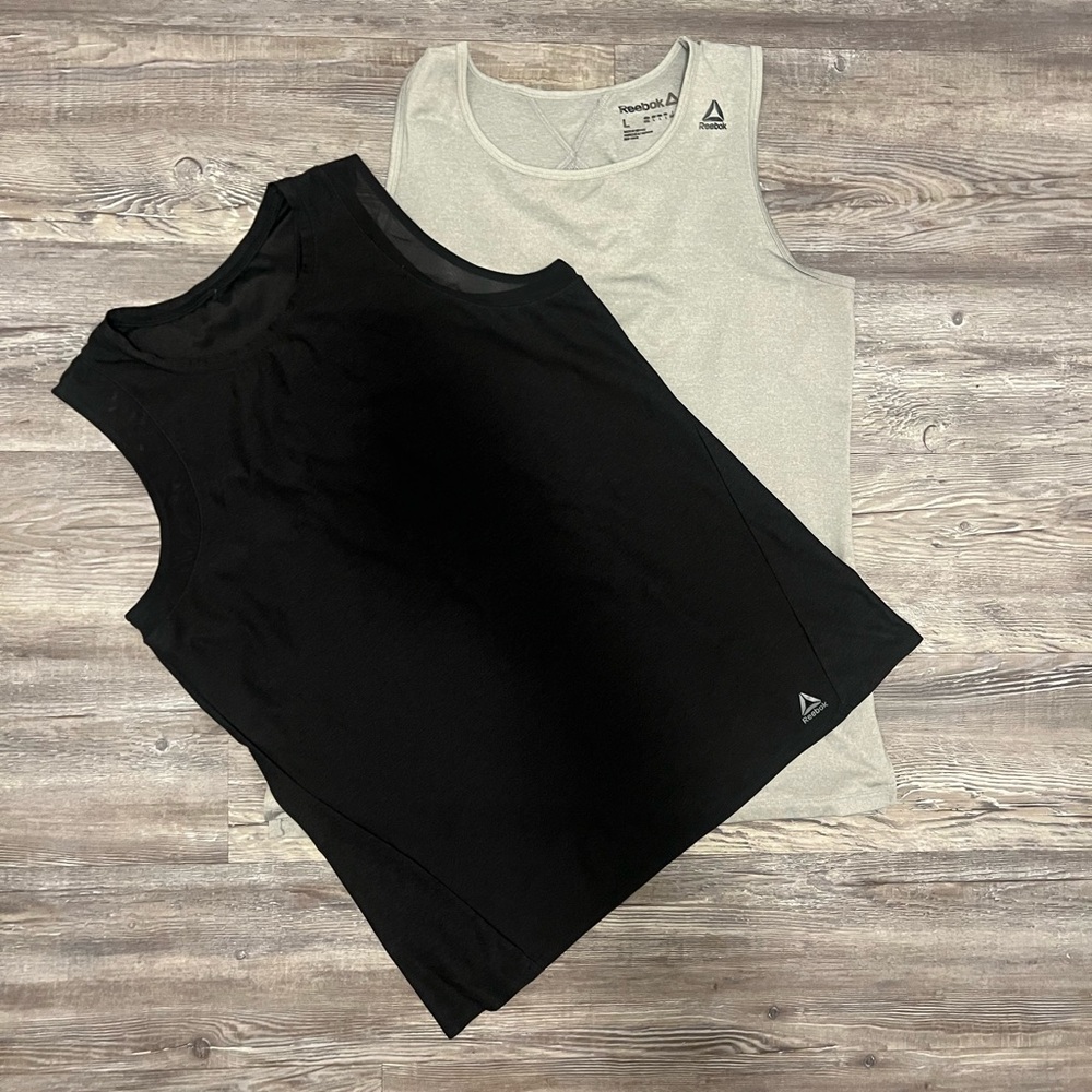 Two Reebok active tank tops
